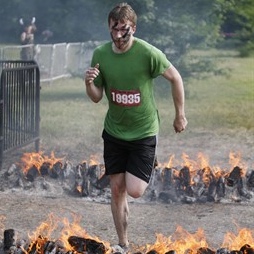 Jeremy jumping over fire during a 2010 Warrior Dash in Texas.